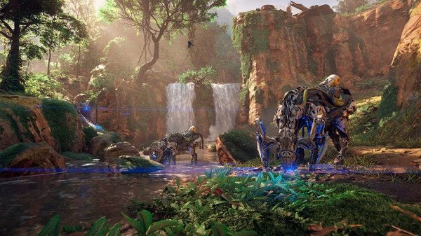 Screenshot from Horizon Zero Dawn™ Remastered showing mechanical creatures near a waterfall in a lush, vibrant forest.