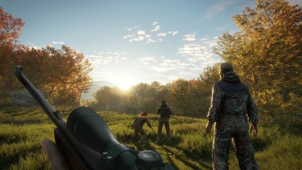 Screenshot from The Hunter Call of the Wild showing hunters in a forest at sunrise, with a rifle in the foreground.