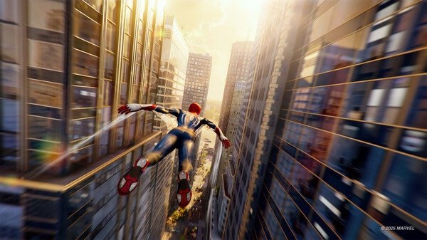 Screenshot from Marvel's Spider-Man 2 shows Spider-Man gliding between skyscrapers in a sunlit cityscape.