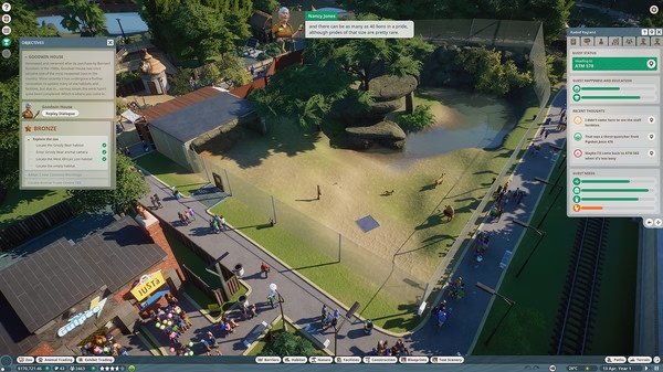 A Planet Zoo screenshot showing a savannah habitat with animals and visitors observing from a walkway.