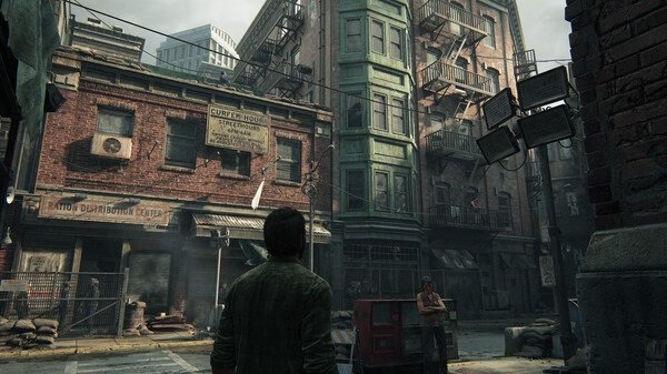 A screenshot from The Last of Us Part I showing Joel in a post-apocalyptic city street with damaged buildings and scattered debris.