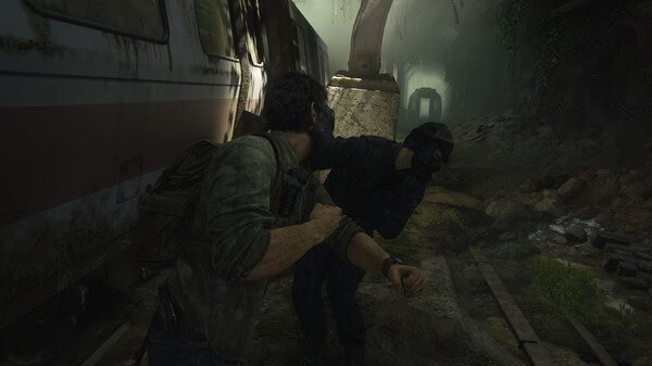 A tense moment in 'The Last of Us Part I' screenshot shows two characters clashing in an overgrown, abandoned subway tunnel.