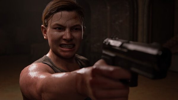 A character from The Last of Us Part II Remastered aims a handgun in a tense moment. Screenshot shows a close-up of their determined expression.