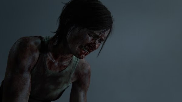 Screenshot from The Last of Us Part II Remastered showing a character with a dirt-streaked tank top against a dim backdrop.