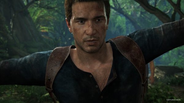 Screenshot from UNCHARTED: Legacy of Thieves Collection showing a character with arms outstretched in a lush jungle setting.