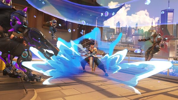 Overwatch® screenshot: Genji deflects an attack with his sword, surrounded by enemies in a futuristic cityscape.