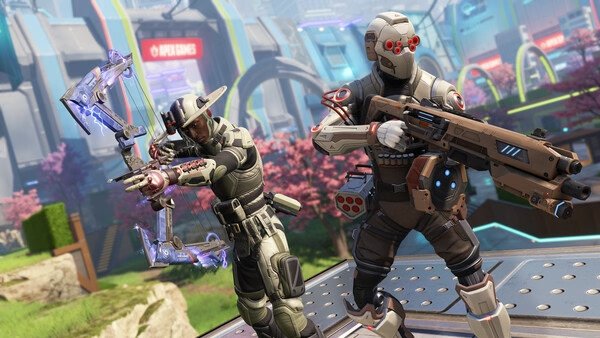 Apex Legends™ screenshot showing two characters in futuristic armor, one with a bow and the other with a rifle, in a vibrant outdoor setting.