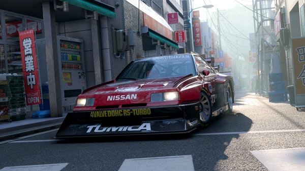A Forza Horizon 6 screenshot showing a red Nissan race car on a sunny urban street surrounded by shops and signs.