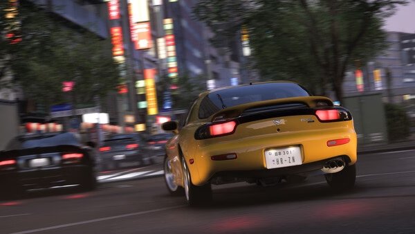 A Forza Horizon 6 screenshot showing a yellow sports car speeding through a brightly lit city street at night.