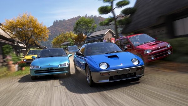 Screenshot from Forza Horizon 6 showing four cars racing through a scenic village road lined with trees and traditional houses.