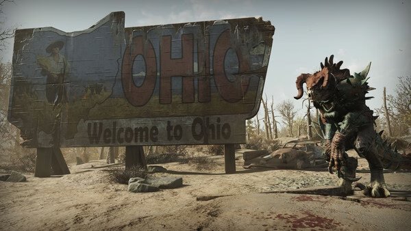 Fallout 76 screenshot: A weathered "Welcome to Ohio" sign stands in a barren wasteland, with a menacing creature nearby.