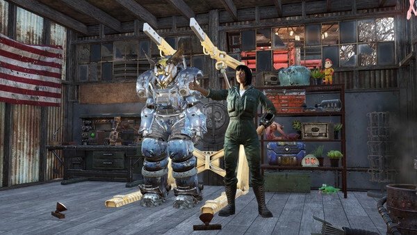 Fallout 76 screenshot: A player character poses in front of a power armor station inside a workshop with various tools and decorations.