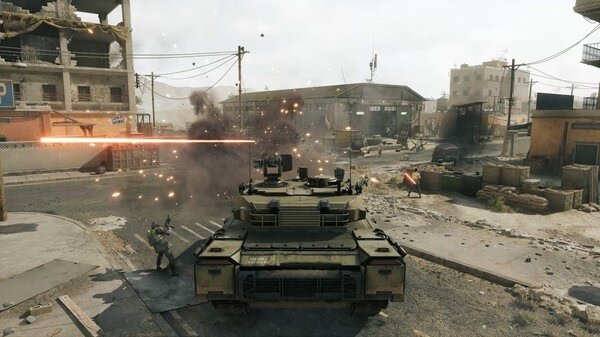 Delta Force screenshot showing a tank firing amidst an urban battlefield, with buildings and explosions in the background.