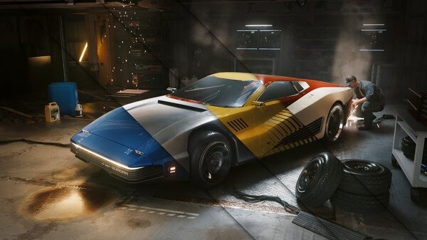 A screenshot from Cyberpunk 2077 showing a vibrant sports car in a garage, with a mechanic working nearby amidst tools and tires.