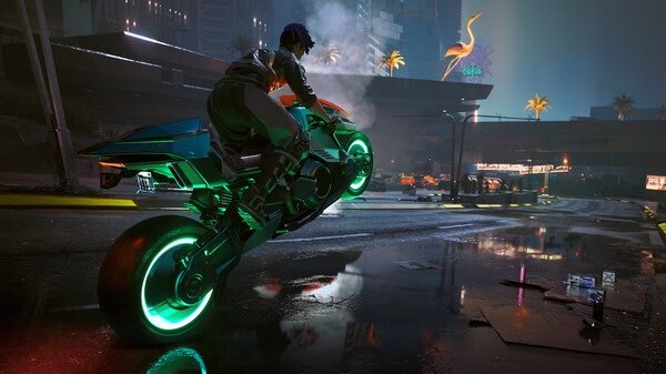 A screenshot from Cyberpunk 2077 showing a character riding a futuristic motorcycle in a neon-lit city at night.