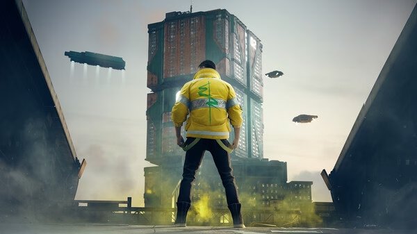 A screenshot from Cyberpunk 2077 shows a character in a yellow jacket facing a towering building with flying vehicles in the sky.