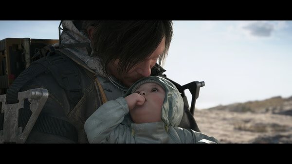 A DEATH STRANDING 2: ON THE BEACH screenshot showing a character holding a baby on a desolate, sandy beach under a bright sky.