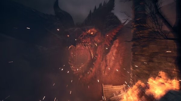 Screenshot from Dragon's Dogma 2 showing a fierce dragon roaring amidst flames and a crumbling stone structure in a dark setting.