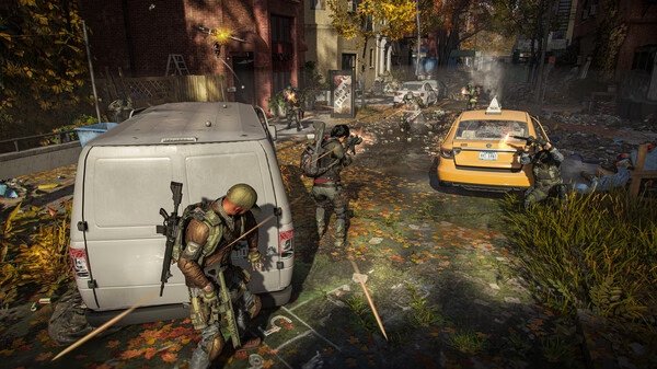 Screenshot from Tom Clancy’s The Division® 2 showing agents in tactical gear taking cover behind vehicles in a city street.