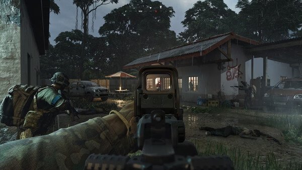 Screenshot from Gray Zone Warfare showing a player aiming through a scope in a rain-soaked jungle village, with soldiers and vehicles visible.