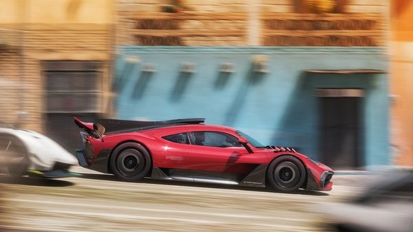 Forza Horizon 5 screenshot featuring a red sports car speeding through a vibrant, colorful street with blurred buildings.