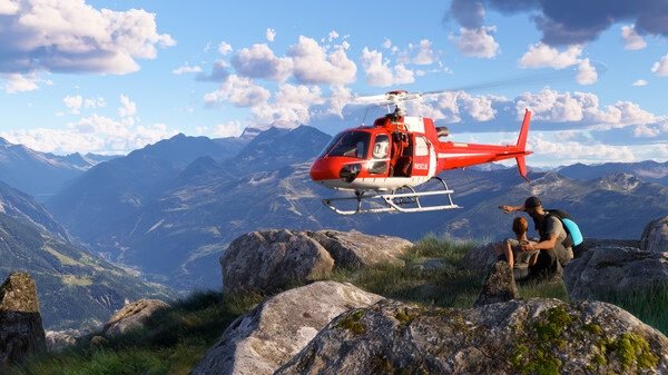 Screenshot from Microsoft Flight Simulator 2024 showing a red helicopter hovering over rocky mountains with two hikers observing.