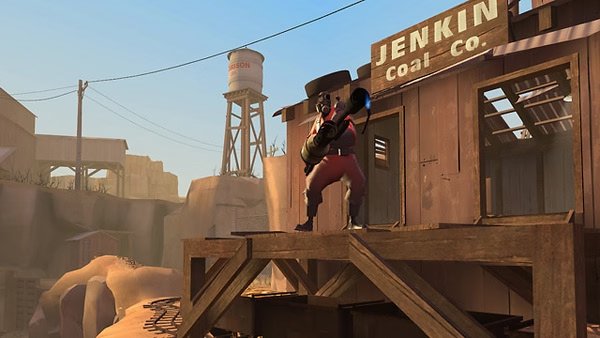 Team Fortress 2 screenshot: A Demoman stands on a wooden platform at the Jenkin Coal Co. building, holding a grenade launcher.