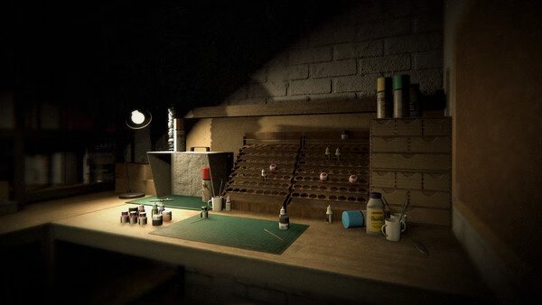 Phasmophobia screenshot showing a detailed workbench with paint bottles and tools in a dimly lit room, highlighting the game's eerie atmosphere.