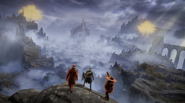 Three characters stand on a cliff overlooking a vast, misty landscape in this Elden Ring screenshot featuring golden trees and ruins.