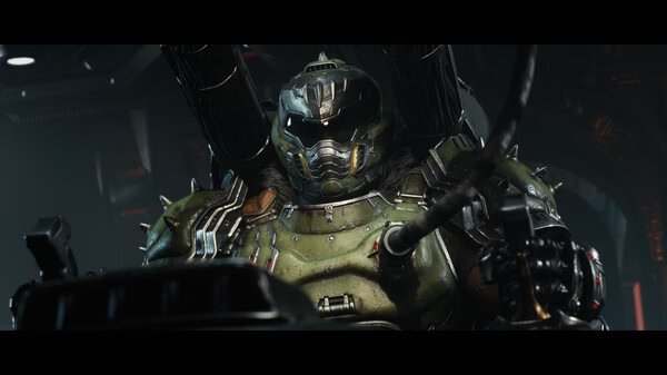 Screenshot from DOOM: The Dark Ages showing a heavily armored character with a futuristic suit and helmet in a dark environment.