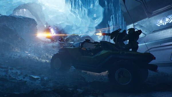 Halo: Campaign Evolved screenshot featuring a vehicle in icy terrain, firing at an enemy with glowing projectiles.