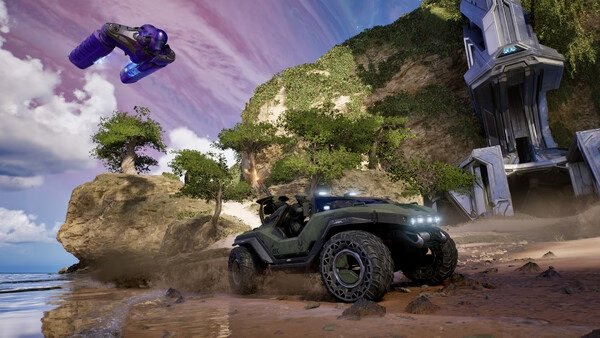 Halo: Campaign Evolved screenshot featuring a Warthog vehicle on a beach, with a purple alien ship hovering above.