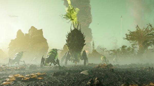 HELLDIVERS 2 screenshot: A group of alien creatures with glowing green accents advance across a foggy, rocky landscape.