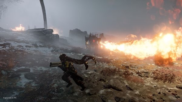 HELLDIVERS 2 screenshot: A player character dodges fiery explosions in a snowy battlefield with a tank firing flames in the background.