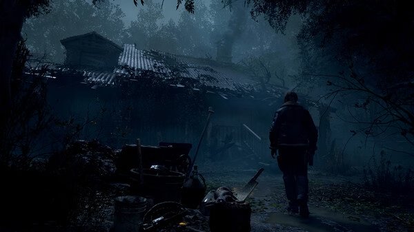 Screenshot from Resident Evil 4 Remake showing a character walking toward a dimly lit, eerie cabin surrounded by dense forest.