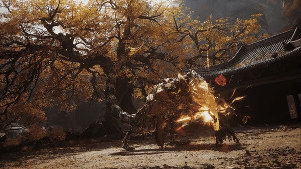 Screenshot from Black Myth: Wukong showing a fierce battle between Wukong and a large, armored creature in an autumn forest.