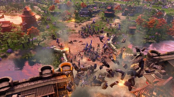 Screenshot from Age of Empires III: Definitive Edition showing a village under siege with buildings, soldiers, and explosions.