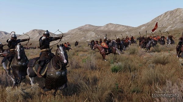 Mount & Blade II: Bannerlord screenshot showing mounted archers aiming bows in a grassy field with mountains in the background.