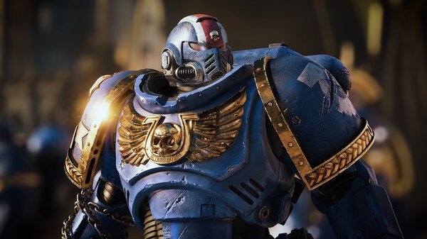 Screenshot from Warhammer 40,000: Space Marine 2 showing a Space Marine in blue armor with golden details.